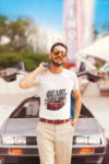 mockup-of-a-man-wearing-a-customizable-t-shirt-against-a-plain-color-backdrop-1422-el1
