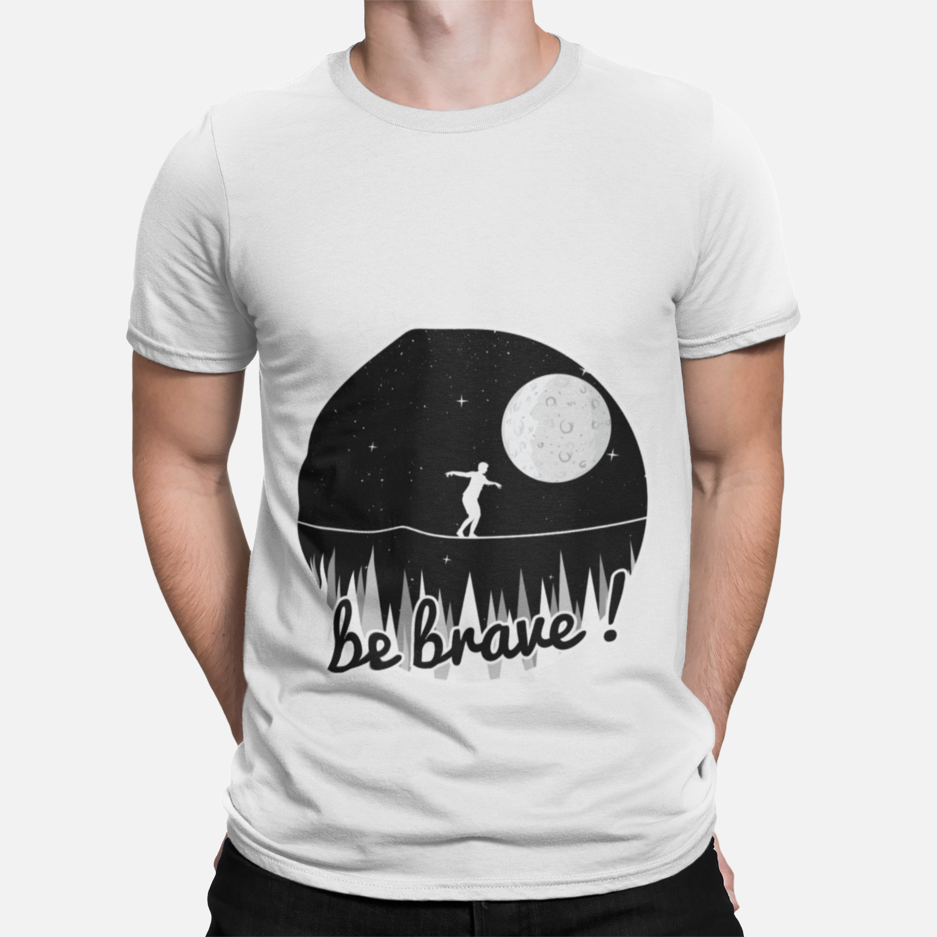 mockup-of-a-man-wearing-a-customizable-t-shirt-against-a-plain-color-backdrop-1422-el1 Unbound Be Brave minimal graphic t-shirt showing a person balancing under the moon